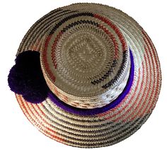 Elevate your style with our Handmade Wayuu Hat, a remarkable fusion of traditional artistry and contemporary fashion. Carefully crafted by skilled artisans from the Wayuu tribe, this hat is a testament to their expertise and cultural heritage. Made from authentic iraca palm fibers, each hat is a unique masterpiece, showcasing the beauty of handcrafted accessories. Features: Artisanal Excellence: The Handmade Wayuu Hat is meticulously handwoven by talented Wayuu artisans, who have honed their cra Artisan Multicolor Fedora Straw Hat, Handwoven Multicolor Brimmed Hats, Multicolor Handwoven Toquilla Straw Hats, Multicolor Handwoven Brimmed Hat, Traditional Multicolor Hat Bands For Summer, Multicolor Woven Hats With Flat Brim, Unique Multicolor Beach Hat, Traditional Multicolor Fedora Hat, Artisan Handwoven Flat Brim Hat