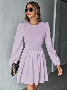 Kismet meets design in this beautifully crafted purple dress, perfect for the fashion-forward individual. The dresssilhouette, characterized by its long, flowing sleeves and cinched waist, exudes a sense of romanticism and grace. The soft fabric ensures a comfortable fit that is both practical and stylish, suitable for a variety of settings from a casual day out to more formal gatherings. Its clean color and simple cut allow for endless styling opportunities, making it a must-have for those who Long Sleeve Backless Dress, Bishop Sleeve Dress, Puffed Long Sleeves, Light Blue Dress, Cute Dress Outfits, Mini Dress Fashion, Puff Long Sleeves, Daily Dress, Everyday Dresses