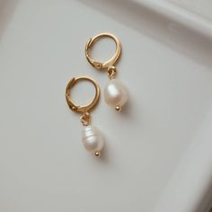 These small pearl drop hoops earrings are perfect for a classic and elegant look, they are made of 18k gold plated stainless steel. I particularly love these earrings for a bride/wedding occasion! Sold in pair ITEM DETAILS Water Resistant- skin-friendly-Tarnish-free Material:18k Gold plated stainless steel hoops Freshwater Pearls **Sizes: Small Hoop Diameter 0.59 in - 15mm Jewelry Care We at Alma Libre Jewelry understand that every person is different and we each have unique skin-oils that may r Teardrop Pearl Drop Huggie Earrings, Classic Gold Huggie Pearl Earrings, Elegant Hypoallergenic Huggie Teardrop Earrings, Everyday Huggie Drop Earrings With Pearl, Classic Gold Hoop Earrings With Pearl Drop, Gold Small Hoop Earrings With Pearl Pendant, Dainty Small Hoop Earrings With Pearl Drop, Classic Single Pear-shaped Pearl Earring, Classic Pearl Huggie Earrings