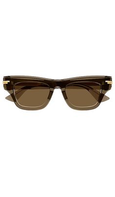 Find BOTTEGA VENETA Original Rectangular Sunglasses In Brown on Editorialist. Bottega Veneta Original Rectangular Sunglasses in Brown. Bottega Veneta Original Rectangular Sunglasses in Brown. Acetate frames. Made in Japan. Lens measures approx 51mm. Bridge measures approx 19mm. Arm measures approx 145mm. BOTR-WA98. BV1122S-006. Bottega Veneta - inspiring individuality with innovative new modes of craftsmanship since 1966. Under the direction of Daniel Lee, creativity lies at the heart of their d Elegant Brown Rectangular Sunglasses, Designer Rectangular Glass Sunglasses, Luxury Rectangular Glass Sunglasses, Transparent Sunglasses, Italian Culture, Rectangular Sunglasses, Bottega Veneta, Made In Japan, Women Men