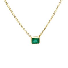 A 18 Karat Yellow Gold Pendant Necklace Featuring a Bezel Set 0.35 Carat Emerald Cut Emerald. The Emerald is Set on a 16 Inch Cable Chain with Lobster Clasp. Finished Weight is 3.5 Grams. Yellow Gold Necklace With Emerald Cut Bezel Setting, Yellow Gold Emerald-cut Necklace With Bezel Setting, Yellow Gold Emerald Cut Necklace With Bezel Setting, Classic Yellow Gold Necklace With Jewels, Classic Emerald Pendant Necklace In Bezel Setting, Classic Emerald Pendant Necklace With Bezel Setting, Classic Bezel Set May Birthstone Necklaces, Classic Necklace With Bezel Setting For May Birthstone, Classic Bezel Set Emerald Pendant Necklace