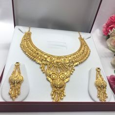 "Handmade Indian Bridal Wedding Jewelry 22ct Heavy Gold Plated Necklace Set with Earrings Indian Jewelry Indian Bollywood Jewelry , its Artificial Jewelry  Type :22ct Gold Plated Necklace Set Earrings Length: 2\"inches Approx Shape - As Shown in Picture It is a perfect match with formal attire on special occasions or with casual wearing Comes in Jewellery Gift Box Traditional Indian Wedding Jewellery Slight Colour variations possible due to difference in screen and photograph Care instructions K 22k Gold Jewelry For Marriage And Festivals, 22k Gold Jewelry For Marriage, Gold Temple Necklace For Marriage And Festivals, Gold Chandbali Necklaces For Anniversary, Yellow Gold Jewelry Sets For Festivals And Anniversary, Gold Bridal Necklace For Marriage And Diwali, Gold Hallmarked Jewelry Sets For Wedding, Yellow Gold Jewelry Sets For Festive Anniversaries, Festive Gold Jewelry Sets For Anniversary