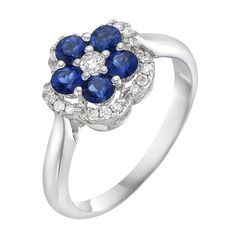 a white gold ring with blue sapphires and diamonds