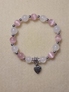 "Hand-made pink and white bracelet. Pink and white 8mm glass beads separated by silver spacers.  \"Made with Love\" charm added. Charm can be customized." Cute Cheap Bracelets, 8mm Beads Bracelets, Glass Beaded Bracelets Aesthetic, 8mm Bead Bracelet, Beaded Bracelets 8mm, Pink And White Beaded Bracelets, Bracelets Of Beads, Pink And White Accessories, Braslets Designs Beads