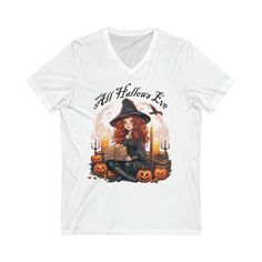 a women's v - neck shirt with an image of a witch sitting on a pumpkin