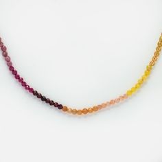 This stunning natural crystal rainbow beaded necklace is the perfect way to add color to your jewelry wardrobe. Harvest Moon is a Local Eclectic exclusive. Natural crystals: Blue sand stone, cordierite, blue agate, kyanite, aquamarine, amethyst, pink tourmaline, red corundum, garnet, orange aventurine, yellow jade, sun Briolette Crystal Necklace With Gemstone Beads For Healing, Spiritual Rainbow Beaded Necklaces With Natural Stones, Briolette Beaded Necklaces For Jewelry Making, Spiritual Rondelle Crystal Necklaces With Gemstone Beads, Briolette Gemstone Beads Crystal Necklace For Healing, Rainbow Gemstone Beaded Necklaces For Jewelry Making, Healing Crystal Necklaces With Faceted Round Beads, Rainbow Round Beads Necklace For Healing, Rainbow Beaded Necklaces With Natural Stones