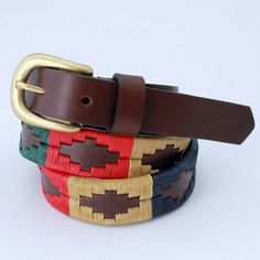 "Polo style leather belt, with \"pampa guard design\". Handmade, with the best cow's leathers, subjected to a vegetable tanning process, which guarantees this product of excellent quality. Zamak buckle, (nickel-free). Approximate leather thickness from 3.5 to 4 mm. Hand-sewn using natural waxed thread, raw color, blue, green and red. Leather slice width 25 mm or 1\" . Made in Argentina! Enjoy this beautiful belt, as popular with polo fans and their lifestyle, as country people and horse lovers. Artisan Brown Embroidered Belt, Brown Embroidered Leather Belt, Brown Leather Belt With Embroidery, Adjustable Embroidered Leather Belt, Adjustable Embroidered Brown Belt, Adjustable Brown Embroidered Belt, Traditional Adjustable Leather Belt, Multicolor Embroidered Leather Belt, Adjustable Multicolor Leather Belts