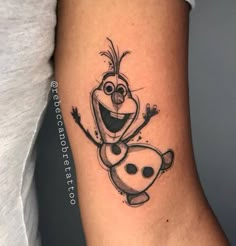 an image of a cartoon character tattoo on the arm