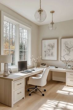 a home office with white furniture and large windows