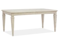 a white table sitting on top of a white floor next to a wooden frame and legs