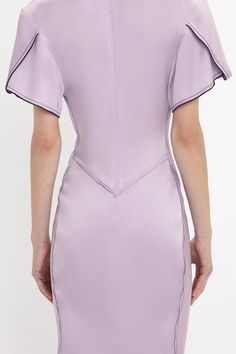 Elegant midi dresses are a hallmark of the Victoria Beckham brand. Crafted in a figure-flattering stretch fabric, this V-neck midi dress in romantic Petunia has a soft curved neckline and waist-defining pleat detail. Draped short sleeves with exposed seams and contrasting navy topstitching inject directional talking points, while a longer-length hem to the back enhances the fluidity of this modern classic. Victoria Beckham Gathered V-Neck Midi Dress In Petunia  - Size 12 UK Elegant Fitted V-neck Dress For Daywear, Fitted Spring Dresses With Structured Boning, Fitted Dresses With Structured Boning For Spring, Structured Boning Midi Dress With Fitted Bodice, Spring Midi Dress With Structured Boning, Spring V-neck Dresses With Structured Shoulders, Spring Fitted Midi Dress With Structured Boning, Fitted Midi Dress With Structured Boning For Spring, Structured Knee-length Evening Midi Dress