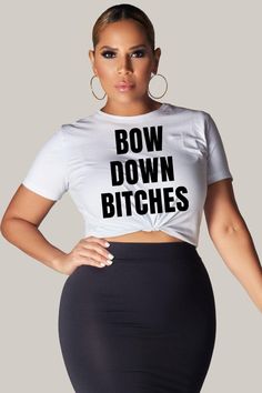 Looking for a bold and empowering statement piece for your wardrobe? Look no further than the "Bow Down Bitches" t-shirt! Made with high-quality soft cotton, this tee feels comfortable and cozy from the very first wear. The ribbed knit collar provides added structure and shape, while the taped shoulders ensure a great fit that lasts wash after wash. This versatile t-shirt is perfect for any casual occasion, from running errands to meeting up with friends. Dress it up with a skirt and heels for a Trendy Stretch T-shirt With Slogan, Trendy Cropped Crew Neck T-shirt With Funny Text, Funny Quote Print Crew Neck Top, Trendy Stretch T-shirt With Screen Print, Funny Text Print Streetwear Top, Funny Quote Print Black Tops, Summer Black T-shirt With Quote Print, Stretch Graphic Tee With Slogan, Trendy Black Tops With Quote Print