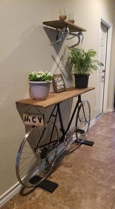 a bicycle with potted plants sitting on it