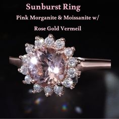 a pink morganite and moissate ring with white diamonds in the center on a black background