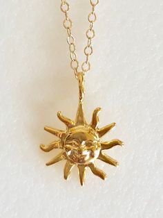 "Darling radiant sun charm necklace in 18k gold vermeil on delicate gold fill chain. Petite smiling face sun charm is 18k gold plate over .925 Sterling silver. Detailed charm measures 15mm with smooth flat back. Total drop with self bail is 3/4\". Necklace is 14k Gold Fill flat cable chain with spring ring clasp. Lovely delicate shiny gold necklace!" Face Sun, Black Cat Earrings, Sunshine Necklace, Sun Charm, Sun Necklace, Face Necklace, Sun Pendant, Gold Sun, Dainty Gold Necklace