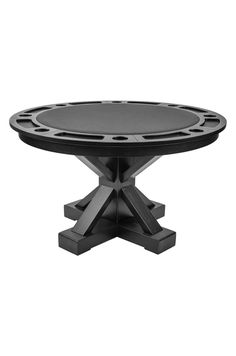 a round table with four legs and a black top on an isolated pedestal, viewed from the front