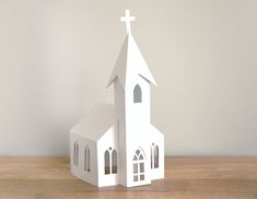 a paper model of a church with a cross on top