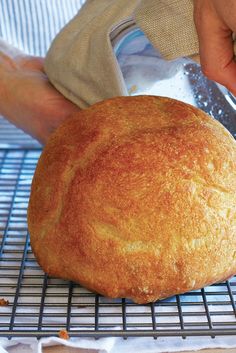 a loaf of bread on a cooling rack