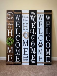 three wooden signs that say welcome and welcome