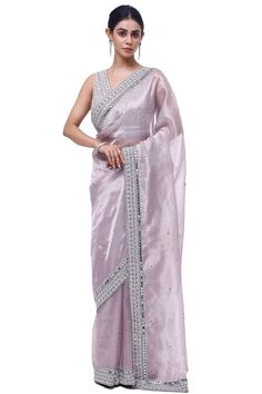 Shop beautiful lilac embroidered tissue saree online in USA with saree blouse. Look your best at parties and weddings in beautiful designer sarees, embroidered sarees, handwoven sarees, silk sarees, organza saris from Pure Elegance Indian saree store in USA.-full view Purple Dola Silk Saree With Mirror Work, Reception Tissue Silk Pre-draped Saree In Purple, Purple Semi-stitched Pre-draped Saree For Celebration, Semi-stitched Purple Pre-draped Saree For Celebration, Lavender Organza Dupatta With Resham Embroidery, Purple Pre-draped Saree With Mirror Work For Eid, Purple Saree With Mirror Work For Celebration, Purple Silk Saree For Reception, Reception Saree With Purple Mirror Work