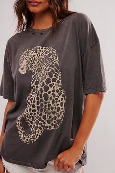 Effortlessly cool and essential, this classic tee is featured in a soft cotton fabrication and oversized fit with leopard graphic at the front and distressed detailing. **Fit:** Slouchy, oversized fit **Features:** Soft cotton fabrication, scoop-neckline, leopard graphic at front, distressed detail throughout, drop-shoulder sleeves **Why We ❤ It:** This timeless tee is sure to become a go-to in any wardrobe. | Leopard Tee by Promesa at Free People in Grey, Size: M Leopard Clothes Aesthetic, Karen Outfit, Boho Graphic Tees, Oversize Graphic Tee, Spring Tee, Leopard Graphic, Tee Shirt Outfit, Leopard Top, Oversized Graphic Tee