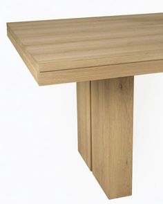 a small wooden table with no one on it's legs or feet, in front of a white background