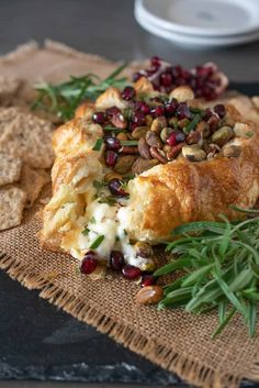 some food is sitting on a table with crackers