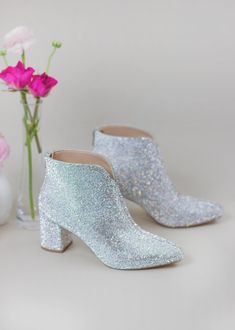 Say hello to our newest style "Bailee"... Perfect sparkly boot with comfortable block heels! Made for modern brides who loves comfort and sparkles! Bailee is truly unique wedding shoes that is perfect for all occasions! Sparkly ankle boot Style “Bailee” in ivory 2.5" heel Sparkly wedding shoes Sizing – This style runs true to size Padded insole for comfort Imported Man-made materials Amazing lace wedding shoes with block heels are perfect for your special day. These gorgeous ivory lace wedding h Gold Bridesmaid Shoes, Prom Shoes Sparkly, Prom Shoes Silver, Comfortable Wedding Shoes, Mother Of The Bride Shoes, Silver Ankle Boots, Sparkly Wedding Shoes, Sparkly Boots, Unique Wedding Shoes