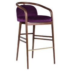 a wooden bar stool with a red velvet upholstered seat and armrests