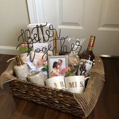 a basket filled with personalized items on top of a wooden floor