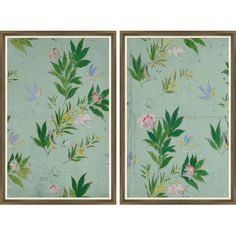 two framed paintings with flowers and leaves on green paper, one in gold frame the other in blue