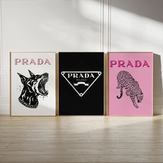 three posters with different designs on them in front of a white wall and wooden floor