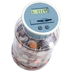 a jar filled with coins and a digital clock