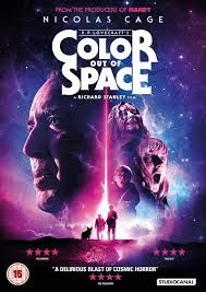 a movie poster for color out of space with two people standing in front of them