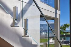 an outside view of a house with glass railings