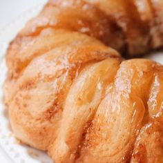 two pieces of pastry sitting on top of a white plate