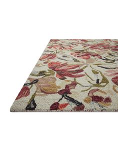 an area rug with flowers and leaves on the bottom in red, pink, green, yellow and white colors