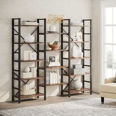 a living room with a couch and book shelf