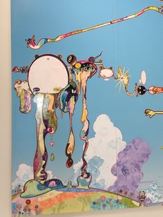 a painting on the wall that is covered in different colors and shapes, with people flying through the sky