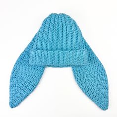 a blue knitted hat on a white background, with the top part folded up