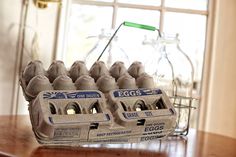 an egg carton sitting on top of a wooden table