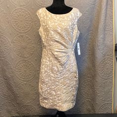 Ralph Lauren Sleeveless Party Dress. Brand New With Tags. Cream Colored Dress With Gold/Taupe Flowered Appliqu, Cap Sleeves And Roughing At Waist For A Slimming Look. Pit To Pit Measures Approximately 19.5” Waist Measures Approximately 17.5” Front Collar To Hem Measures Approximately 35.5” Hemline Measures Approximately 19.75” The Widest Part Of The Hips Measures Approximately 19.75” Beige Sleeveless Evening Dress For Spring, Elegant Fitted Sleeveless Holiday Dress, Elegant Beige Sleeveless Dress For Party, Elegant Beige Sleeveless Party Dress, Beige Sleeveless Dress For Cocktail In Spring, Beige Sleeveless Dress For Spring Cocktail, Beige Knee-length Sleeveless Party Dress, Lined Sheath Sleeveless Dress For Party, Sheath Sleeveless Lined Dress For Party