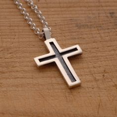 "This handmade oxidized sterling silver cross pendant features a unisex design that is modern, yet elegant, combining just the right amount of style and grace. It is an ideal jewelry option for either a man or woman. Suspended from a sterling silver chain or a black leather cord 48cm long with silver clasp and endings, it is the perfect way to share your message of faith with those around you. It also makes a modern fashion statement that makes an exceptional gift for anyone on your gift list. Y Sterling Silver Oxidized Crucifix Necklace, Oxidized Sterling Silver Cross Pendant Necklace, Sterling Silver Oxidized Cross Necklace, Gift Sterling Silver Cross Necklace With Oxidized Finish, Silver Casting, Silver Cross Necklace, Sterling Silver Cross Pendant, Silver Cross Pendant, Modern Necklaces