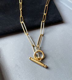 A unique paperclip style necklace that features 14k gold plating and a high polish finish Sci Fi Jewelry, Green Calcite, Paperclip Necklace, Resin Ring, Trombone, Domed Ring, Sterling Silver Cross, Ring Photos, Moon Necklace