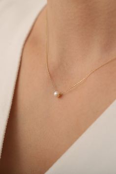 14K Solid Gold Dainty Pearl Necklace / Minimalist Pearl Necklace /Handmade Pearl Jewelry / Gift for Her / Mothers Day Gift / anniversary gift / birthday gift / chocker necklace   * Gold KT: 14K Solid Gold * Gold Color: 14K Gold * The length of the chain in the photo is 17 inches. * The pearl used in the necklace is a real cultured pearl. Follow on Instagram - @bayargold.tr My Web Site - https://www.bayargold.com/ * Bayar Gold is a fine jewelry company. Please do not hesitate to ask us questions. We are always here to help you. * All items are packed in the high-quality jewelry box. The gift message is available. Please let us know what to write by leaving us a note at checkout.  * Gift wrapping available.  Express shipping * United States: 4-6 business days * Canada: 4-6 business days * Eu Delicate Necklace With Simple Design For Gifts, Delicate Simple Necklace For Gift, Delicate Simple Design Necklace For Gift, Everyday Minimalist Pendant Birthstone Necklace, Delicate Everyday Necklaces With Simple Design, Delicate Simple Necklaces For Everyday, Minimalist Yellow Gold Pearl Necklace, Minimalist Pearl Pendant Necklace For Anniversary, Minimalist Everyday Pearl Necklace With Round Pendant