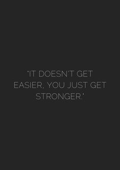 a black and white photo with the words it doesn't get easier, you just get strong