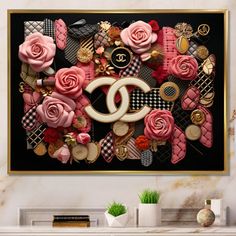 a chanel painting with pink roses and other items