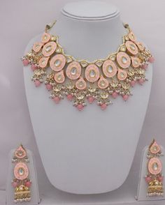 Pakistani Kundan Pink Necklace Earrings Set, Kundan Jhumka Earrings Set, Indian Women Jewelry Set, Indian Bridal Minakari Jewelry Set Adorn yourself with this beautiful Kundan Necklace Earrings Set ITEM DESCRIPTION Metal = Gold Plated Occasion = Wedding ,Party Wear, Bridal Color = Pink and Clear Size = Necklace Length = 14 CM Earrings Size = 9 CM Necklace Weight =150 gm Earrings Weight = 21 gm Free Shipping Chandbali Necklaces With Matching Earrings For Diwali, Diwali Chandbali Jewelry Sets With Latkans, Navratri Meenakari Jewelry, Festive Chandbali Jewelry Sets With Matching Earrings, Festive Chandbali Bridal Necklace With Matching Earrings, Festival Jewelry Sets With Meenakari In Round Shape, Diwali Round Jewelry Sets With Latkans, Diwali Jewelry Sets With Latkans, Festival Jewelry Sets With Meenakari Detailing