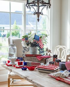 the table is decorated with red, white and blue decorations