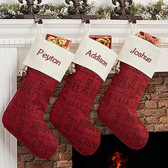 two christmas stockings hanging from a fireplace mantel with personalized names on them,